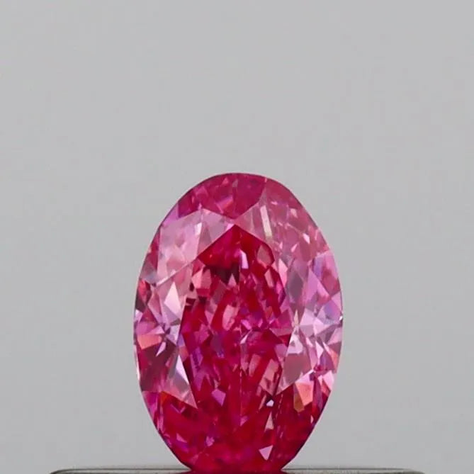 0.23ct oval lab grown diamond (colour fancy vivid pink, clarity vvs2, igi certified)