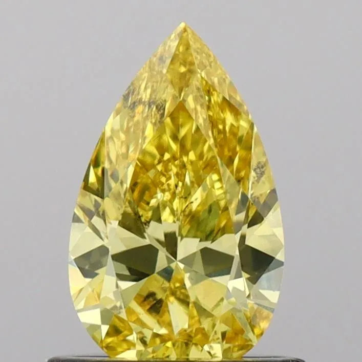 0.72ct pear lab grown diamond (colour fancy vivid yellow, clarity vs2, igi certified)